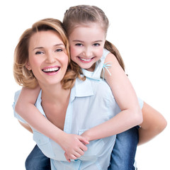 Closeup portrait of happy mother and young daughter