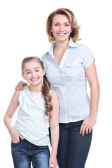 Full portrait of happy mother and young daughter