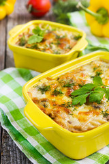 pasta, mushrooms and cheese gratin in casserole dish
