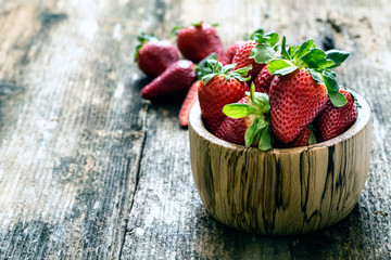 wooden bowl of fresh strawberries