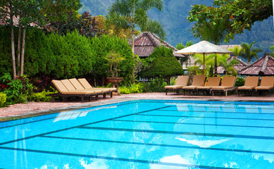 pool with blue water in a recreation area of hotel in tropics