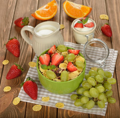 Natural muesli with strawberries and grapes