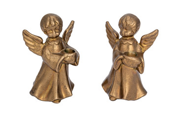 Fototapeta na wymiar Brass candlesticks in the form of angels holding a candle
