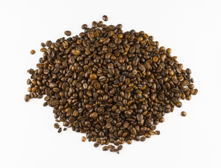 Heap of roasted coffee beans isolated on white background