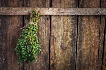 thyme bunch on an old wooden background