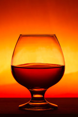Whiskey or brandy on a wooden table