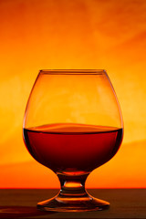 Whiskey or brandy on a wooden table