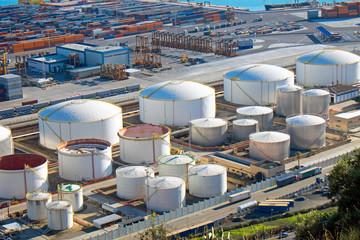 Gas tanks and containers seen in a big port