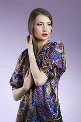 Beautiful fashion woman touching her hair