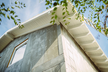 roof and windows against a sky