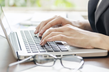 woman typing document in an office