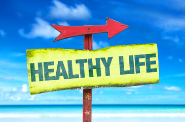 Healthy Life sign with beach background