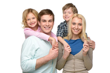 Obraz premium Cheerful smiling family of four looking at camera