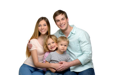 Smiling young family of four enjoying time together