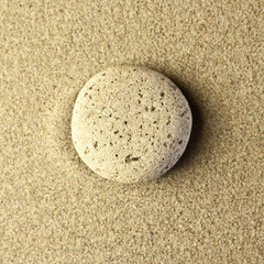 Fototapeta na wymiar one stone in the sand