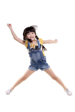 Portrait Of Happy Little Asian Child Jumping Isolated On White