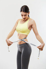 Diet. Beautiful Sporty Woman With Measuring Tape