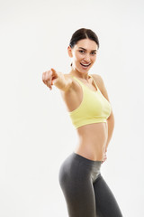 Sport Woman Pointing on You Against White Background
