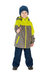 Fototapeta premium Little boy in a jacket holds his thumb up