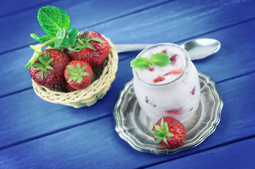 Strawberry yogurt  with fresh fruits and mint leaves