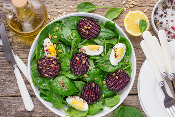 Fresh spinach salad, eggs and roasted beets