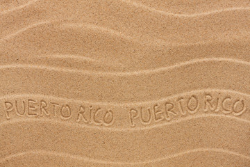 Puerto Rico inscription on the wavy sand