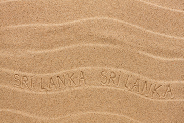 Sri Lanka inscription on the wavy sand