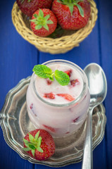 Strawberry yogurt  with fresh fruits and mint leaves