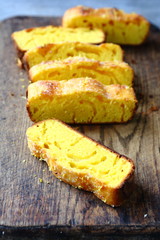 Six pieces of lemon cake on a cutting board