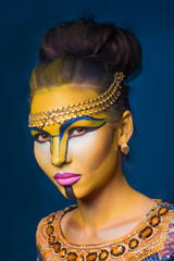 Beautiful woman with tribal face make up