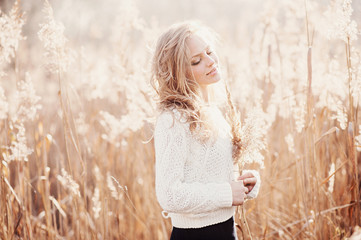 Portrait of a beautiful young blonde girl, smiling