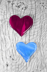 A couple in love - Cherry Red and Blue Glass Heart Symbols.