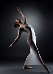 Sexy graceful ballerina posing in studio