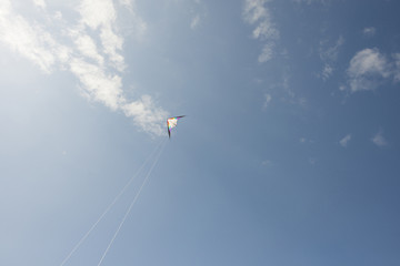 Man flying a kite on the beach.