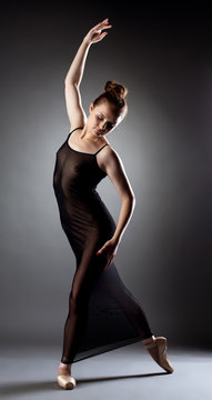 Exciting ballerina dancing in erotic black dress