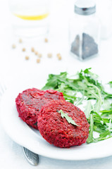 chickpeas, quinoa and beet burgers with arugula