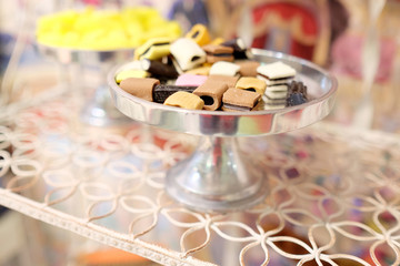 Multicolored candies in silver bowl