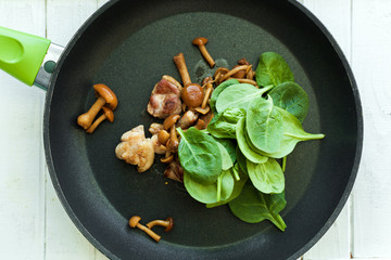 cooking tasty dish from meat and tomatos