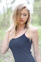 Naturally young blond woman outside in nature