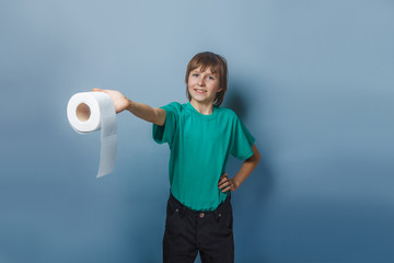 European-looking  boy of  ten  years with  toilet paper on a gra