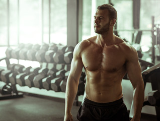 Young man posing in gym