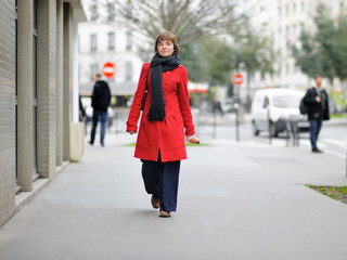 Stylish girl walking on a Paris