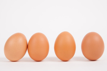 Chicken eggs  on white paper background