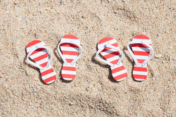 Two Pairs Of Striped Flip-flops