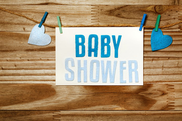 Baby shower card hanging with clothespins