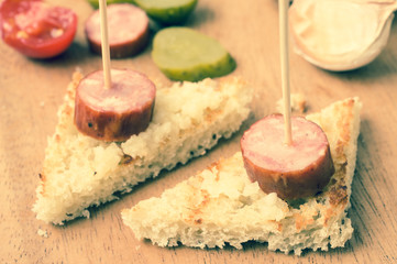 Pintxos snacks with smoked sausage
