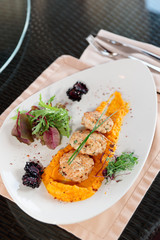 White meat patty cakes with pumpkin mash