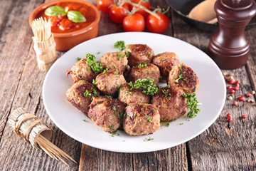 fried meatball and tomato sauce