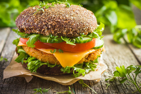 Healthy fast food. Rye burgers with fresh vegetables, chickpeas