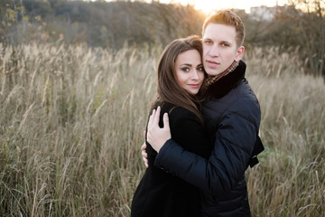 Couple at sunset in the forest